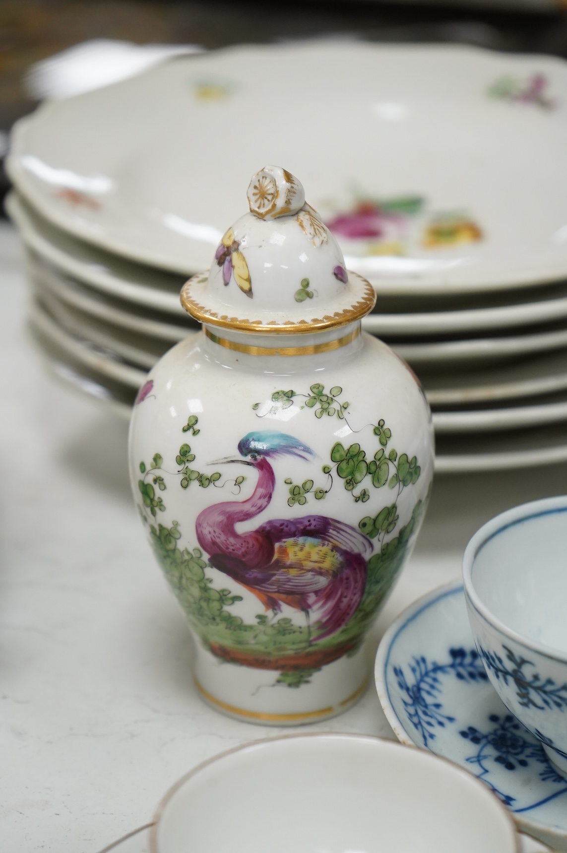 A group of 18th/19th century Continental porcelain, including six 18th century Vienna porcelain plates, a Meissen onion pattern dish, a pair of mid-18th century Meissen teacups and saucers, two tea bowls and saucers and